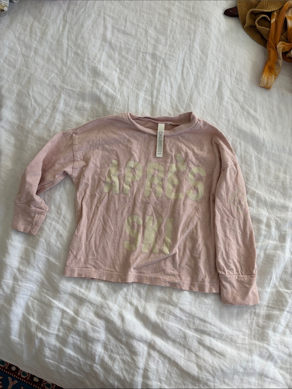 Childhood clothing apres ski long sleeve pink shirt.